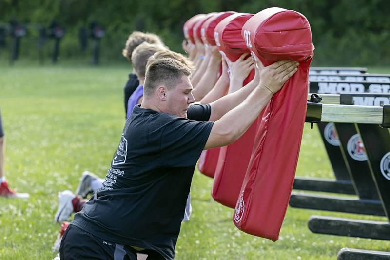 The Morrison football team goes through workouts during a camp Tuesday, July 25, 2023. The Mustangs will open their season against Mendota at the end of August.