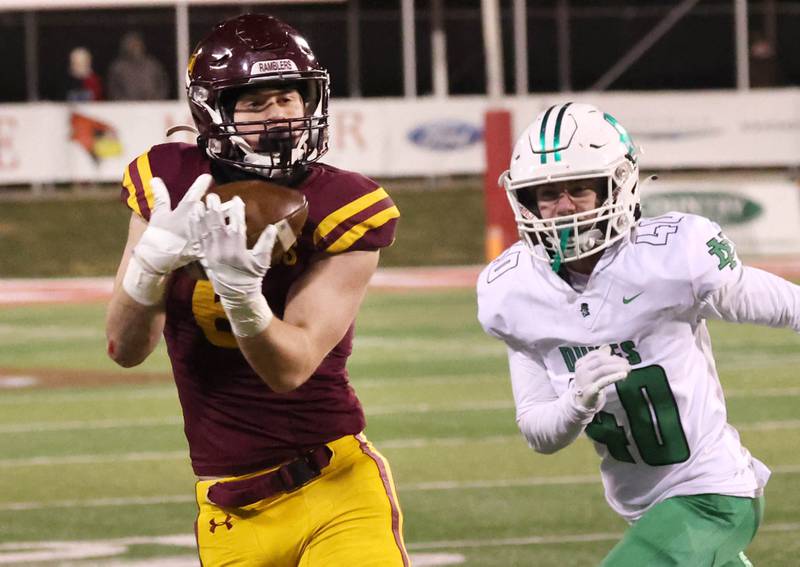 Loyola Academy's Gavin Vradenburg makes a catch in front of York’s Noah Zmrhal during their Class 8A state championship game Saturday, Nov. 30, 2024, in Hancock Stadium at Illinois State University in Normal.