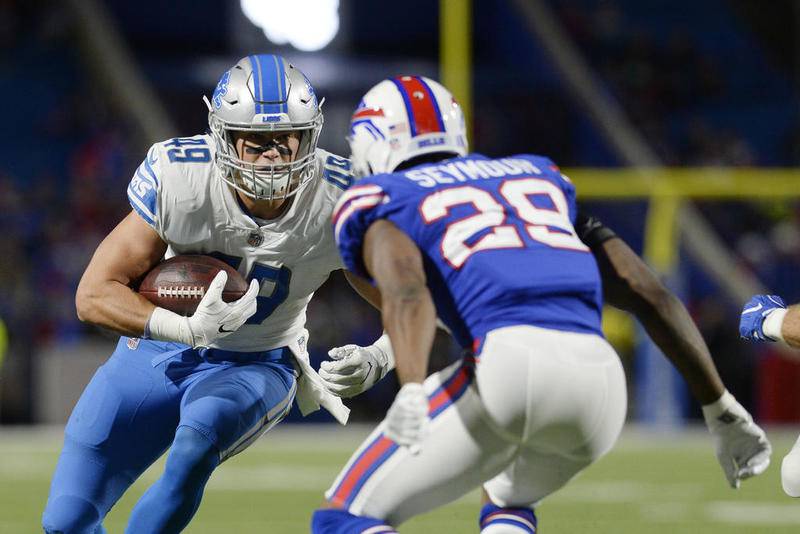 Buffalo Bills' Kevon Seymour tackles Detroit Lions' Robert Tonyan during the second half of a NFL preseason game Thursday, Aug. 31, 2017, in Orchard Park, N.Y. Tonyan, a McHenry grad, signed a futures contract with the Green Bay Packers Tuesday.
