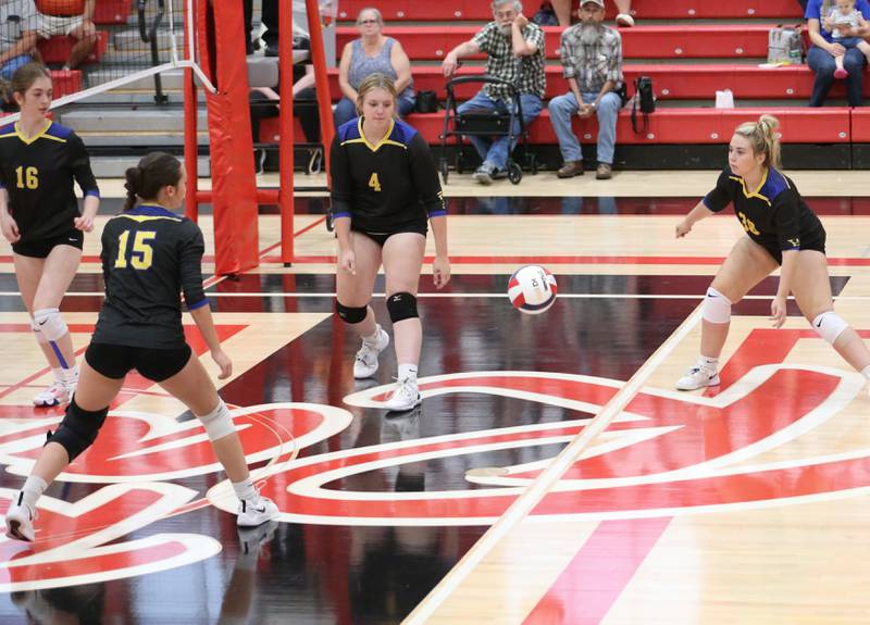 Somonauk players (from left) Aubrey Chiavario, Josie Rader, Morgan Potter and Addie Britt watch the ball fall into the middle of the court as Earlville scores a point on Tuesday, Aug. 29, 2023 at Earlville High School.