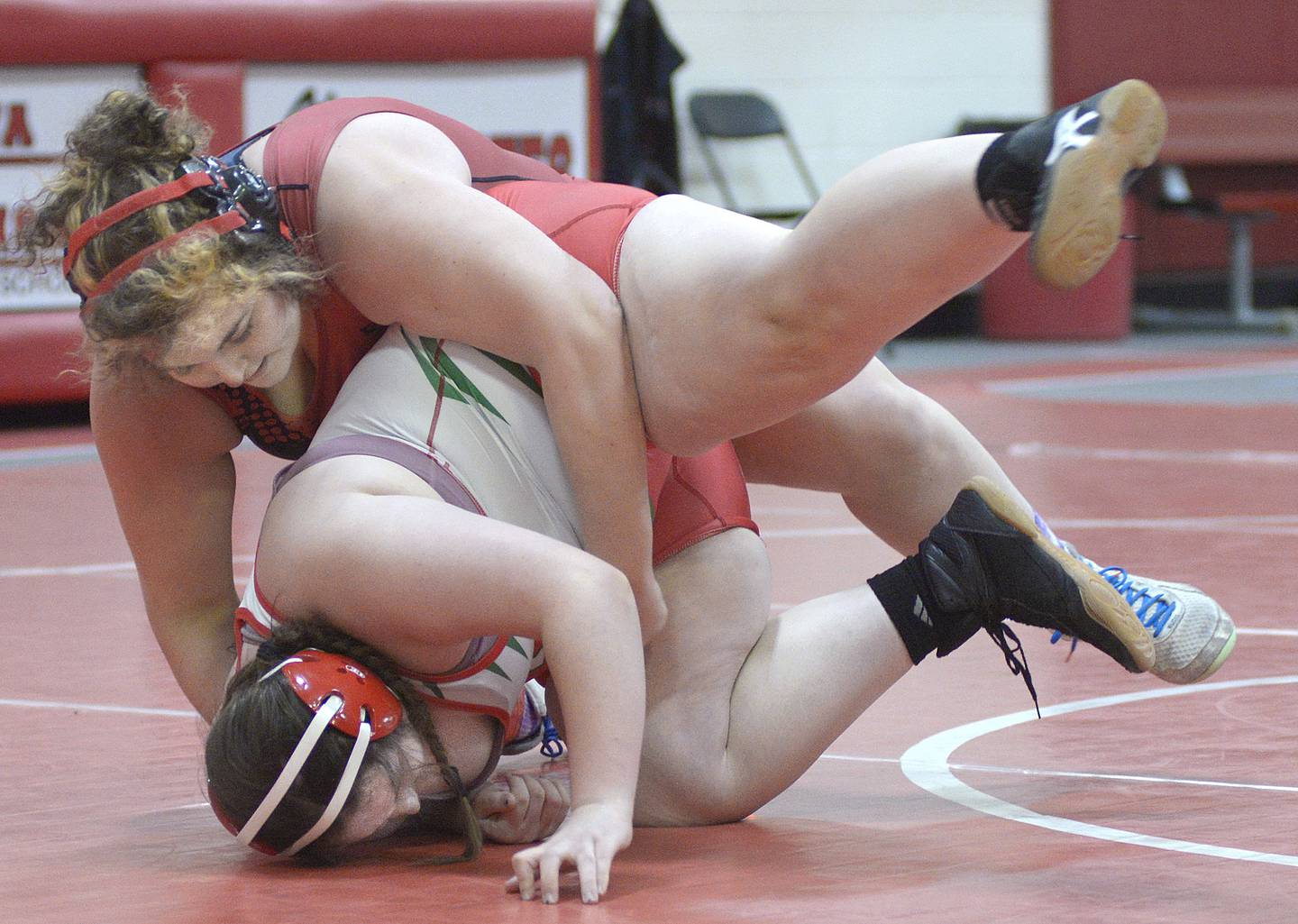 Ottawa’s Juliana Thrush takes La Salle-Peru's Lily Higgins to the mat Tuesday, Dec. 30, 2025, during the Ottawa Hootenanny in Ottawa's Love Gym.