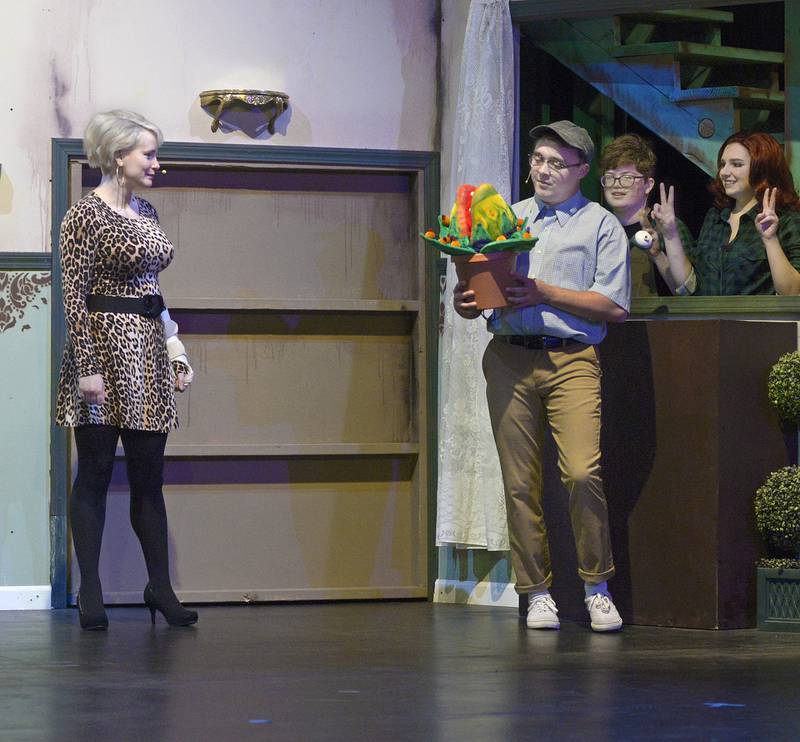 Careful, Seymour, that plant has a taste for blood. Jordan Christopherson (second from left) plays Seymour in "Little Shop of Horrors" at Stage 212. Seymour discovers an exotic plant that wins the attention of his longed-for Audrey (Faith Albright, left), but which unleashes terror on Skid Row.