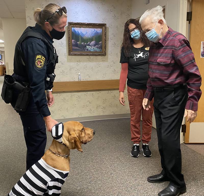 Officer Sara Rokey and Lucy, the search and find bloodhound, also paid a special visit with the seniors at Greenfield before the parade. Lucy dressed up in a prison-stripes costume.