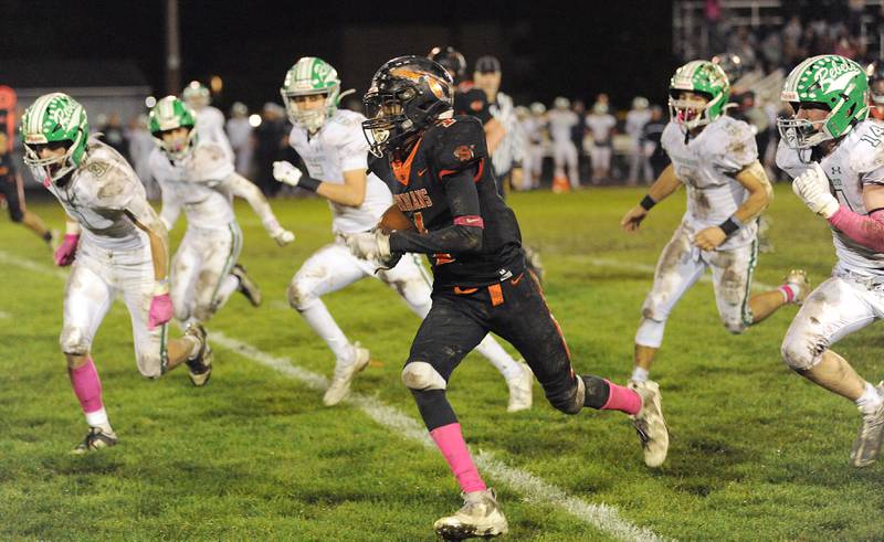 Sandwich running back Simeion Harris (1) speeds past the Ridgewood defense for another touchdown during a varsity football game at Sandwich High School on Friday, Oct. 27, 2023.
