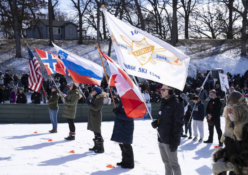 The flags of the countries taking part in the competition are displayed during the opening ceremonies at the Norge Annual Winter Ski Jump Tournament on Sunday, January 26, 2025 at the Norge Ski Jump in Fox River Grove.