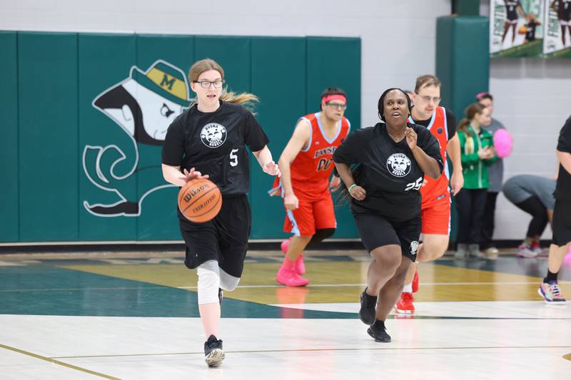 River Valley Special Rec player Julia McManimen brings the ball up alongside teammate Jasmine Smith in their game against Lincolnway Special Recreation Association at Bishop McNamara on Friday, Jan. 30, 2026.