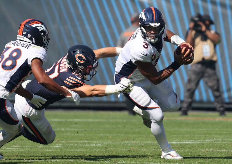 Chicago Bears linebacker Jack Sanborn pressures Denver Broncos quarterback Russell Wilson which leads to a sack during their game Sunday, Oct. 1, 2023, at Soldier Field in Chicago.