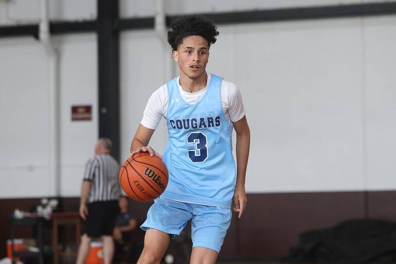 Plainfield South’s Caleb Navarro works the ball up-court against Morris at the 37th Morris Boys Shootout on Tuesday, June 25, 2024.