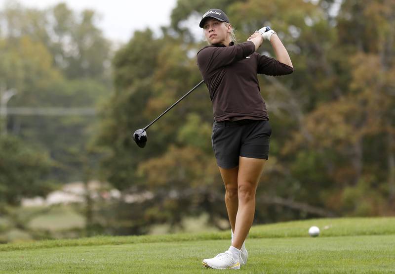 Jacobs’ Natalie Zimmerman watches her tee shot on the 14th hole during the Fox Valley Conference Girls Golf Tournament Wednesday, Sept. 24, 2025, at Crystal Woods Golf Club in Woodstock.