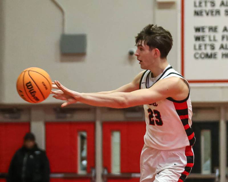 Benet's Edvardas Stasys (23) passes the ball during their Class 4A Bolingbrook Sectional semifinal basketball game between Yorkville at Benet, March 3, 2026 in Bolingbrook.