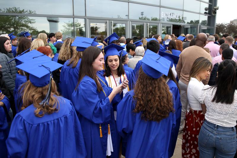 St. Charles North graduates gather before the school’s commencement ceremony at the Northern Illinois University Convocation Center in DeKalb on Monday, May 23, 2022.