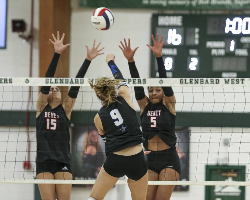 Benet's Sophia Youssef (15) and Brooklynne Brass (5) goes fora block during Class 4A Glenbard West Sectional final volleyball match between St Charles North at Benet. Nov 6, 2025 in Glen Ellyn.