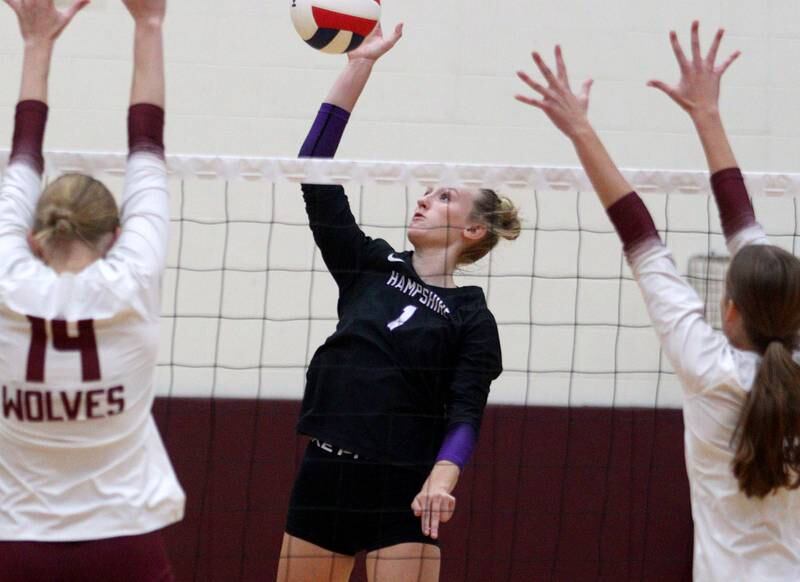 Hampshire’s Elizabeth King sends the ball over the net  during varsity volleyball on Thursday, Oct. 3, 2024, at Prairie Ridge High School in Crystal Lake.