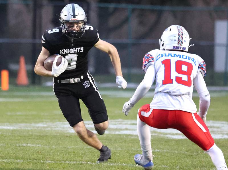 Kaneland's Carter Grabowski looks to get by Lakes' Porter Cramond Saturday, Nov. 1, 2025, during their first round playoff game at Kaneland High School in Maple Park.