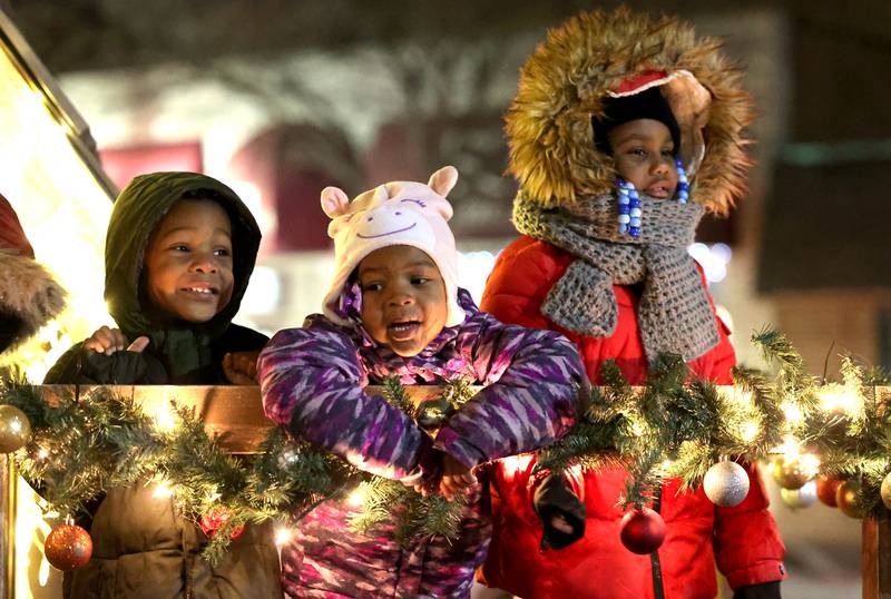 Kids sing carols as they wait for Santa at the Santa house near the Egyptian Theatre Thursday, Dec. 1, 2022, during the DeKalb Chamber of Commerce Lights on Lincoln and Santa Comes to Town.