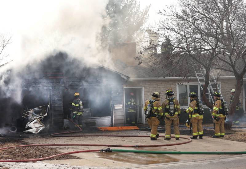 Firefighters work the scene of a garage fire in the 1900 block of Shooting Park Road on Monday, Feb. 9, 2026 in Peru. La Salle, Peru, Utica, Oglesby and Spring Valley fire departments were dispatched around 12:15p.m. to the fire.