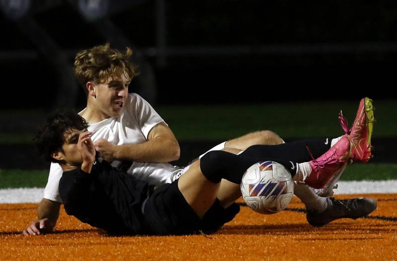 McHenry's Jhosmar Mujica battle with Huntley's Tyler Murray for the ball during a Fox Valley Conference boys soccer match on Thursday, Oct. 9, 2025, at McCracken Field in McHenry.