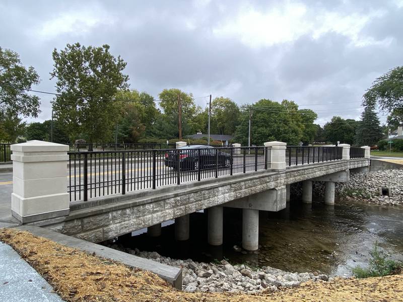 A car travels across the Lucinda Avenue bridge near Northern Illinois University campus in DeKalb on a rainy Sunday afternoon, Sept. 22, 2024. The traffic detour also has been lifted.
