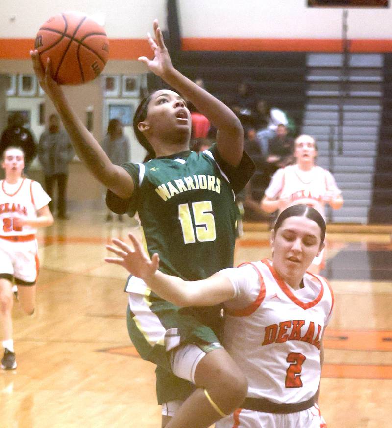 Waubonsie Valley's Taylor Curry shoots over DeKalb's Ella Medina during their game Thursday, Dec. 15, 2022, at DeKalb High School.