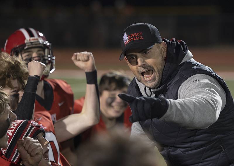 Amboy coach Scott Payne celebrates his second consecutive championship with his team Friday, Nov. 22, 2024, during the 8-man football championship in Monmouth.
