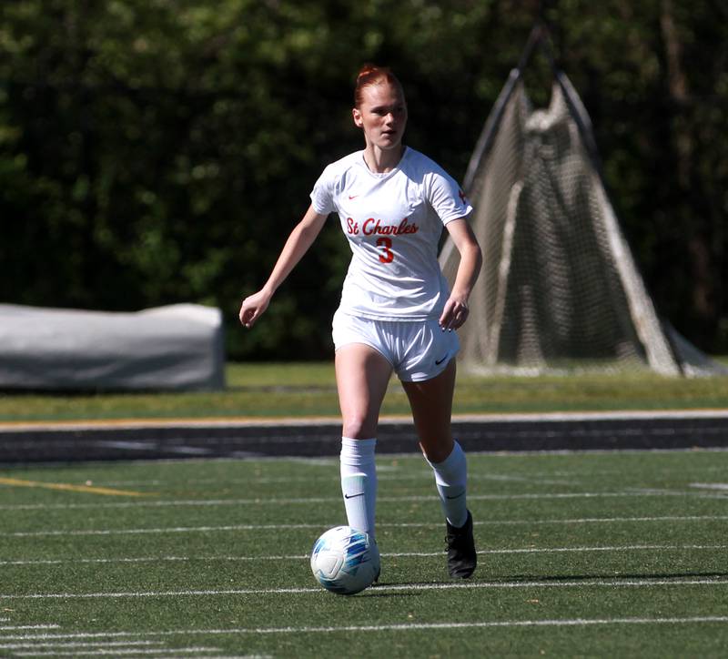 St. Charles East's Reese Kyle looks to pass the ball during a game against Wheaton Warrenville South on Friday, May 16, 2025 in Wheaton.