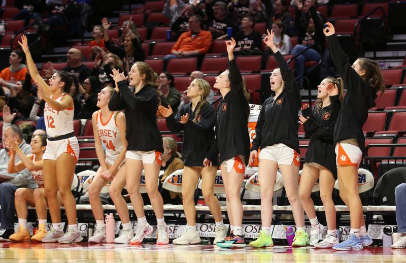 Members of the Hersey girls basketball team react after a player scores a basket during the Class 4A third place game on Friday, March 3, 2023 at CEFCU Arena in Normal.