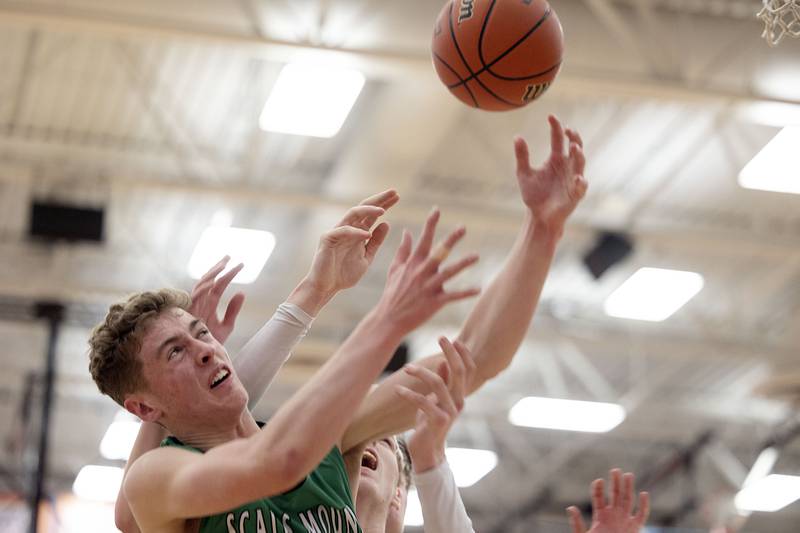 Scales Mound’s Thomas Hereau goes for a rebound against Fulton Friday, March 3, 2023 in the 1A sectional final in Lanark.