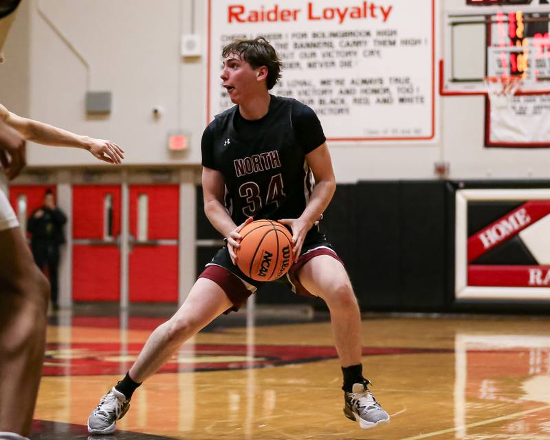 Plainfield North's Quintin Wiencek (34) steps back to shoot a jumper during their basketball game between Plainfield North at Bolingbrook, Friday Dec 13, 2024 in Bolingbrook.