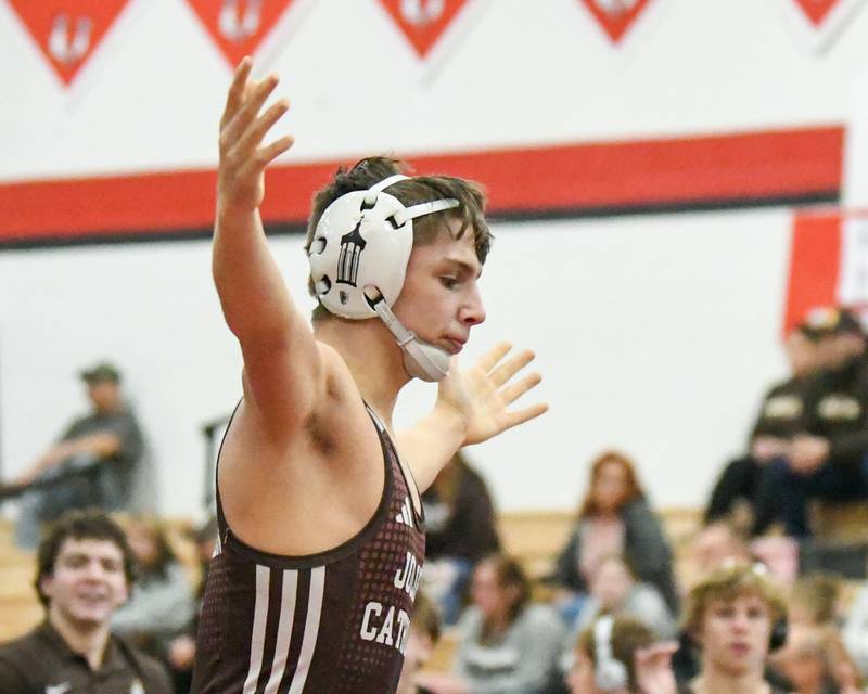 Matthew Lair of Joliet Catholic Academy celebrates his pin over Yorkville ‘s Nathan Cra in the 126-weight class ft on Tuesday Feb. 25, 2025, held at Yorkville High School.