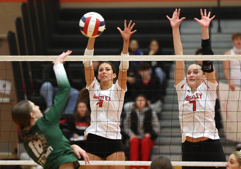 Huntley's Diellza Sejdini (left) and Jocelyn Erling try to block Fremd’s Sasha Sallade Monday, Nov. 11, 2024, during their Class 4A supersectional match at DeKalb High School.