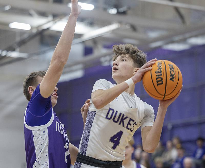 Dixon’s Brody Nicklaus looks to put up a shot against Rochelle’s Van Gerber Monday, Dec. 9, 2024, at Dixon High School.