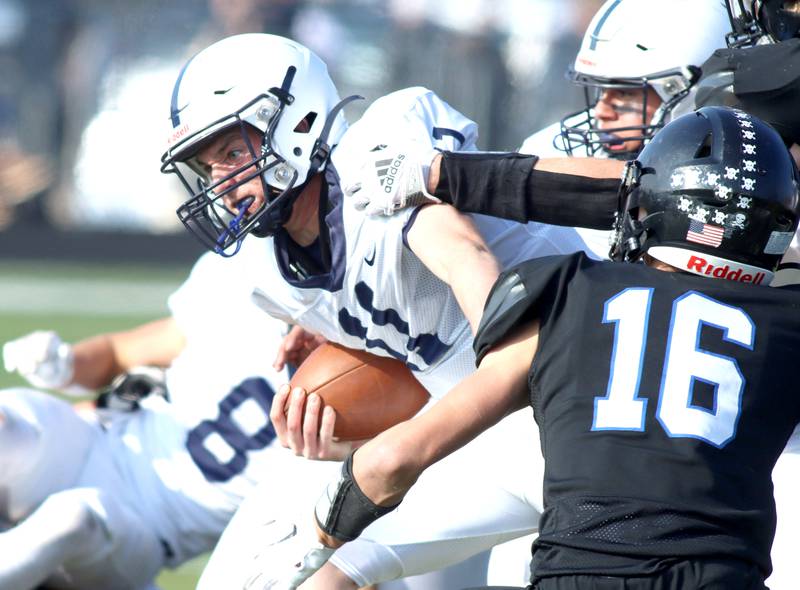 Cary-Grove’s Peyton Seaburg finds running room against Highland Park in second-round IHSA Class 6A playoff action at Wolters Field in Highland Park Saturday.