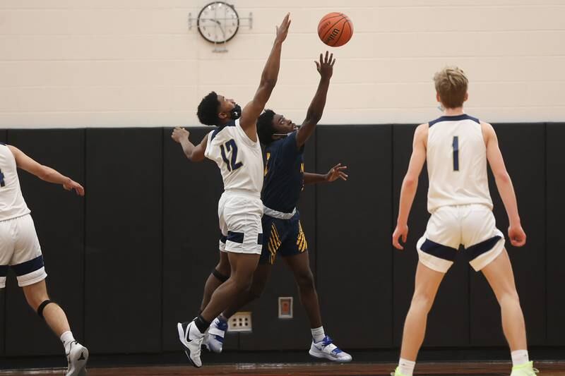 Neuqua Valley’s Bryan Thomas draws the foul from Lemont’s Miles Beachum in the Warrior Showdown shootout at Lincoln-Way West. Saturday, Jan. 29, 2022 in New Lenox.