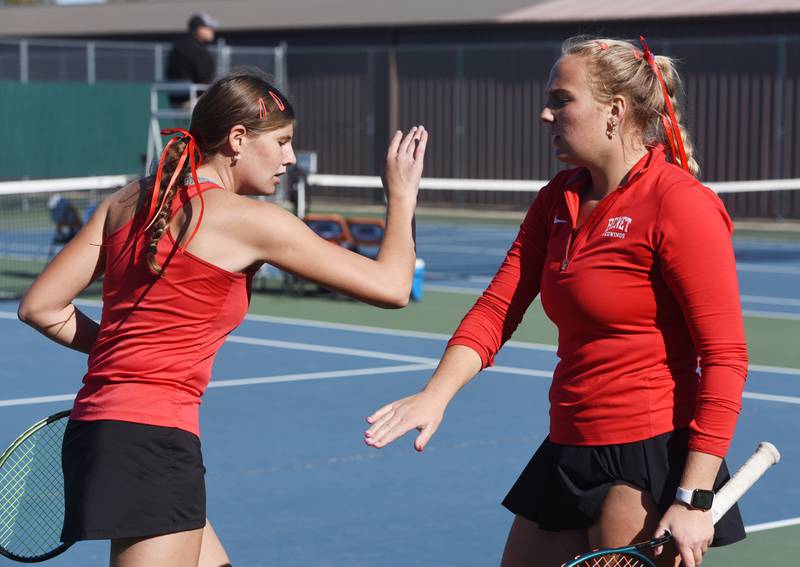 Benet Academy’s Clare Lopatka, left, and Shane Delaney celebrate a point during the Class 1A doubles championship match of the girls state tennis tournament at Hersey High School on Saturday, Oct. 26, 2024 in Arlington Heights.