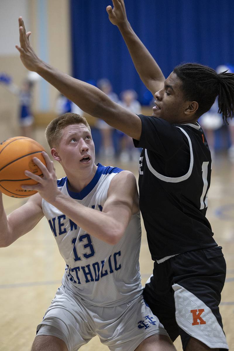 Newman’s George Jungerman works below the basket against Kewanee’s Brayden Conley Friday, Jan. 10, 2025.