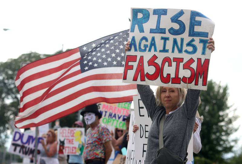 Julie Horvath of Crystal Lake participates during the “Good Trouble Lives On” protest along Route 14 in Crystal Lake on Thursday, July 17, 2025.