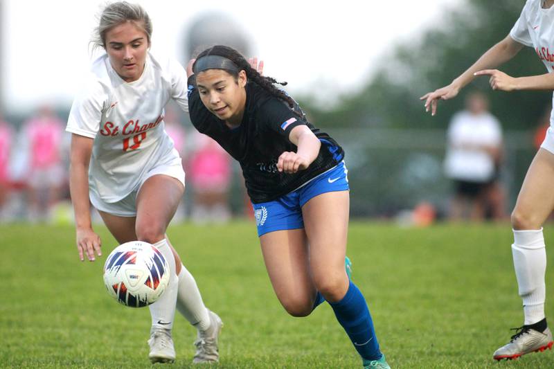 St. Charles East’s Payton Rivard (left) and St. Charles North’s Juliana Park go after the ball during a Class 3A South Elgin Sectional semifinal game on Tuesday, May 21, 2024.
