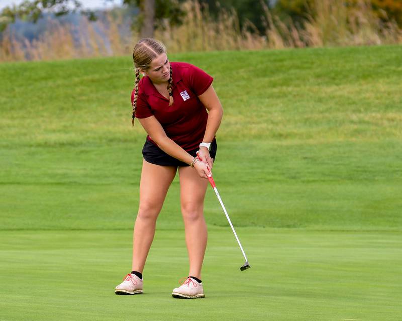 Naperville Central Poppy Marusin putts during the back half of the regional match Thursday Sep. 28, 2023, held at Whitetail Ridge in Yorkville.