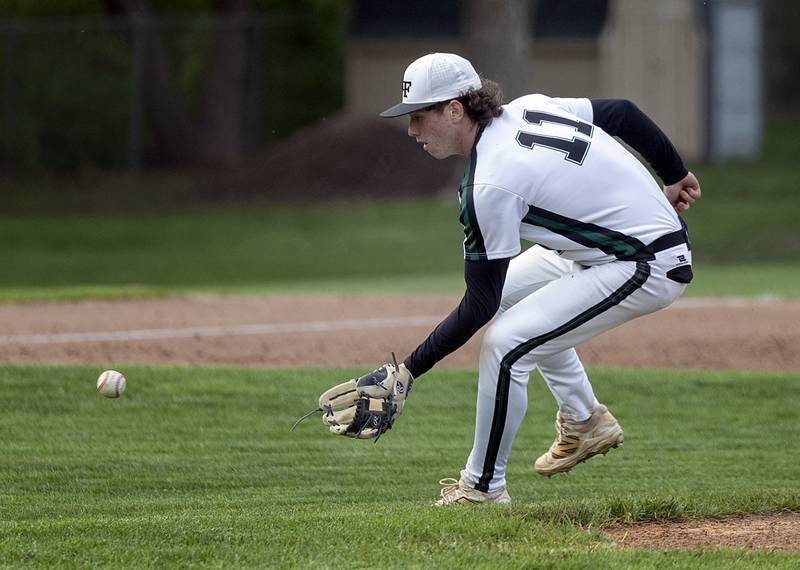 Rock Falls’ Carter Hunter comes off the mound to make a play against North Boone Tuesday, April 28, 2026. Hunter came in to pitch in relief of Ethan Moeller.