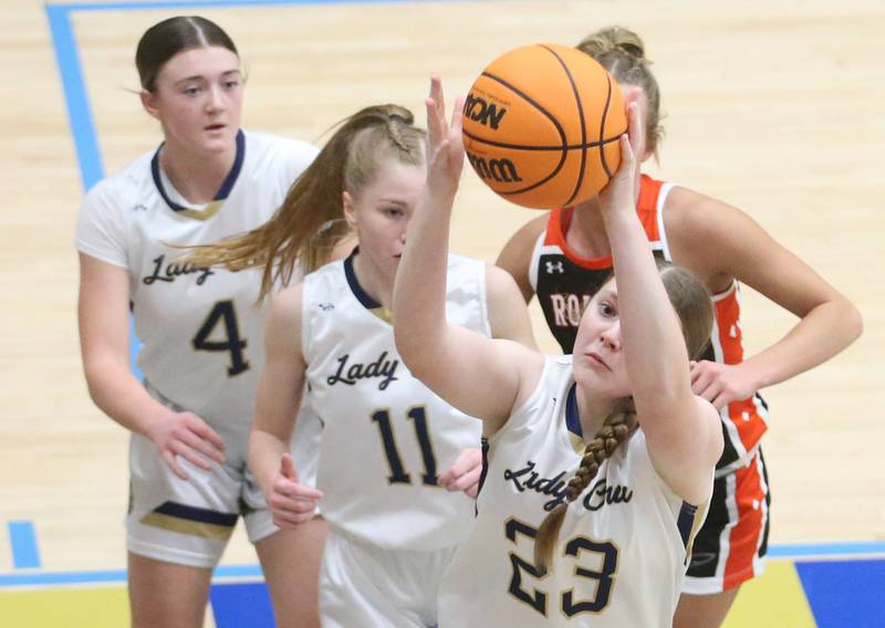 Marquette's Kelsey Cuchra grabs a rebound against Roanoke-Benson on Thursday, Feb. 6, 2025 in Bader Gym at Marquette High School.