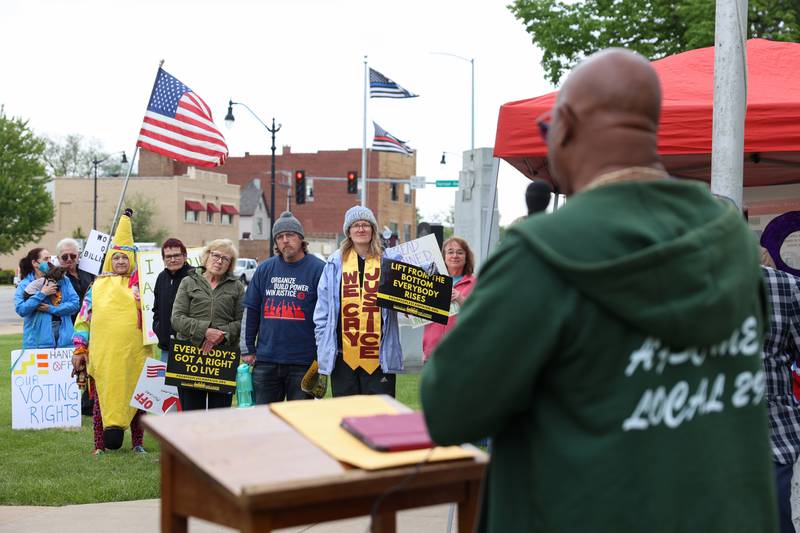 Protesters listen as Danny Williams, a union activist with American Federation of State, County and Municipal Employees (AFSCME), speaks during the May Day Strong rally at the Kankakee County Courthouse on May 1, 2026, as part of a national day of action.