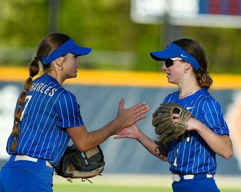 St. Charles North's Ella Heimbuch, right, gets congratulated by teammate St. Charles North's Mackenzie Patterson, after catching the ball during the game on Wednesday April 24, 2024, while traveling to take on Lake Park High School.