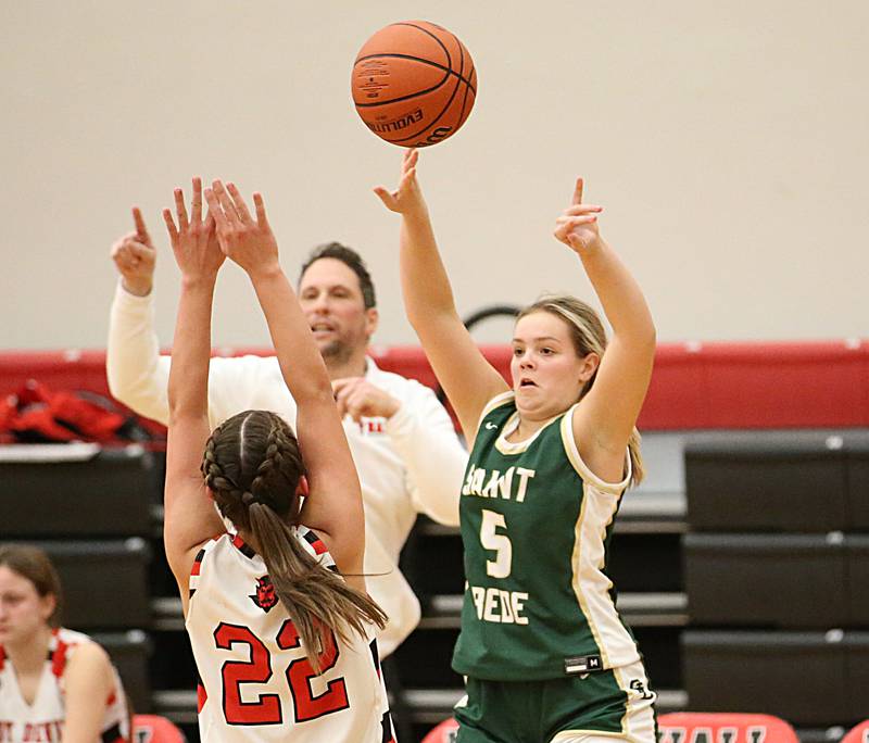 St. Bede's Sadie Koehler (5) passes the ball around Hall's Kennedy Wozniak (22) on Monday, Nov. 28, 2022 at Hall High School in Spring Valley.