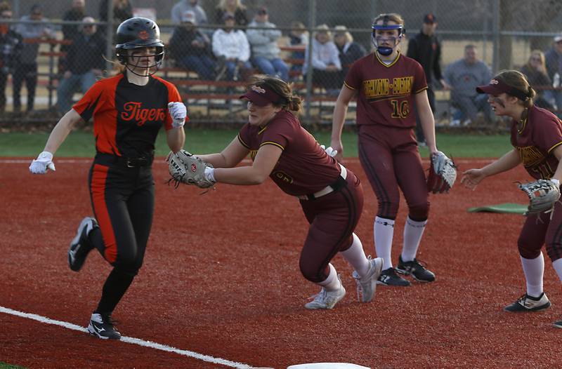 Crystal Lake Central's Makayla Malone gets past the diving tag attempt of Richmond-Burton's Norah Spittler as she runs to first base during a nonconference softball game Wednesday March 16, 2022, between Crystal Lake Central and Richmond-Burton at Lippold Park in Crystal Lake.