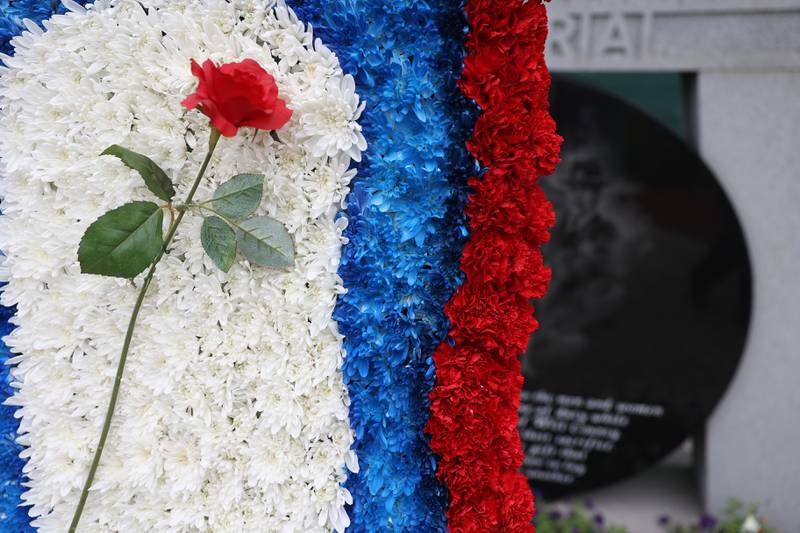 The memorial wreath sits in front of the Will County Law Enforcement Memorial at the memorial ceremony on Thursday, May 9, 2024 in downtown Joliet.