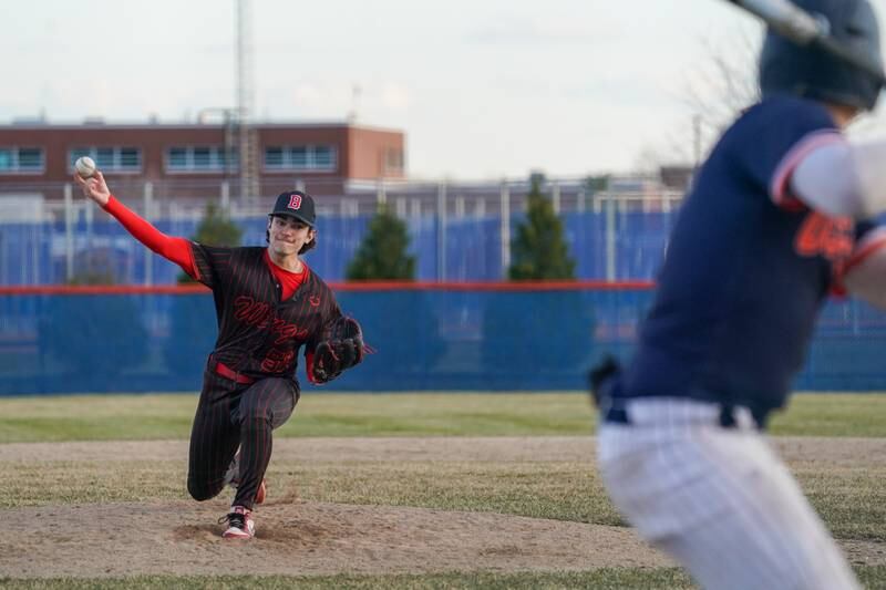 Benet’s Anthony Filippo (50) delivers a pitch against Oswego during a baseball game at Oswego High School on Tuesday, March 25, 2025.