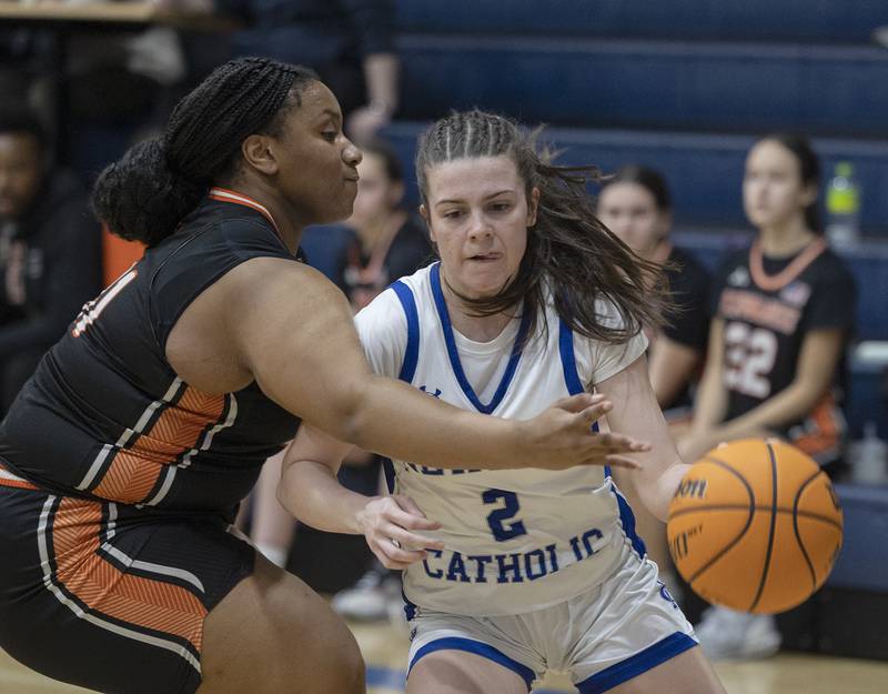 Newman’s Helen Papoccia handles the ball against  Kewanee’s Stardeja Jordan Thursday, Feb. 6, 2025, at Newman High School.