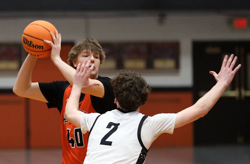 McHenry's Nate Ottaway looks to pass as he is guarded by Crystal Lake Central's Danny Spychala during a Fox Valley Conference boys basketball game on Tuesday, February. 10, 2026, at Crystal Lake Central High School.