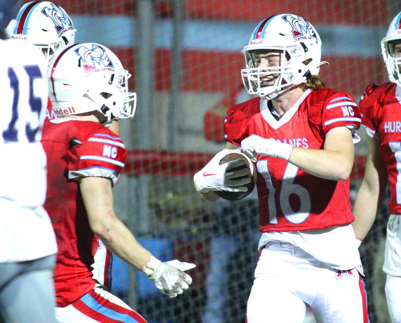 Marian Central’s Jacob Sievert is greeted in the end zone after hauling in a touchdown reception against Chicago Hope in varsity football at Woodstock Friday night.