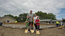 New Habitat family receives homeowner policy